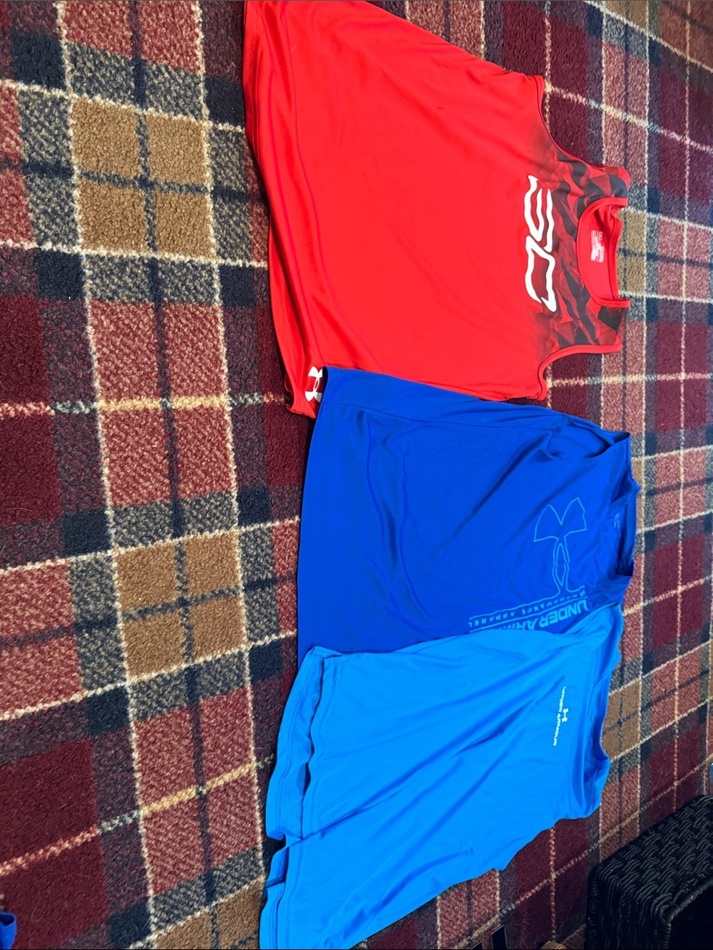 3 boys YXL Under Armour shirts.